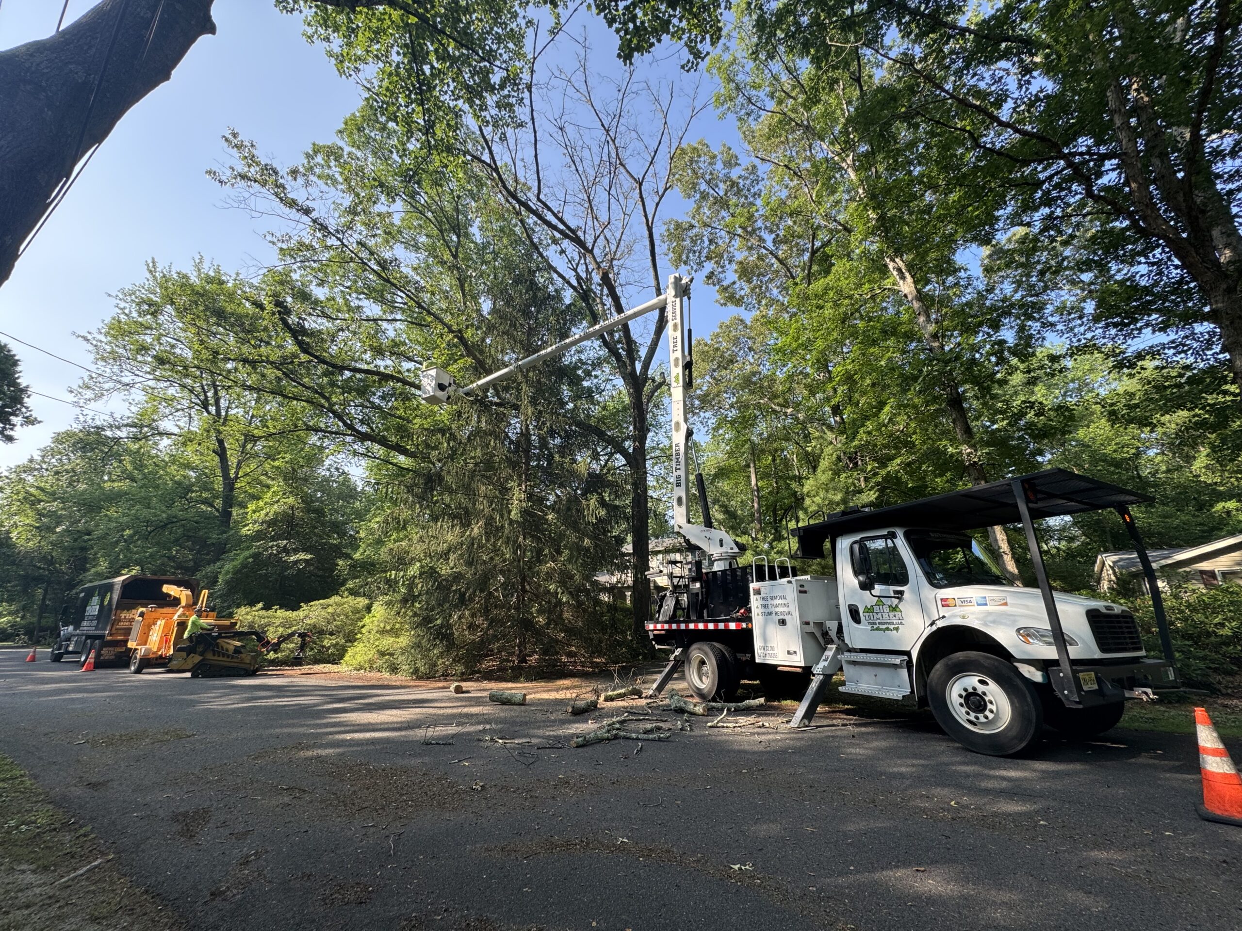 Bucket truck performing emergency storm damage tree removal in Haddonfield, NJ